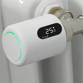 Zigbee Smart Gateway Hub for Smart Home Automation displaying temperature on a white device connected to a radiator.